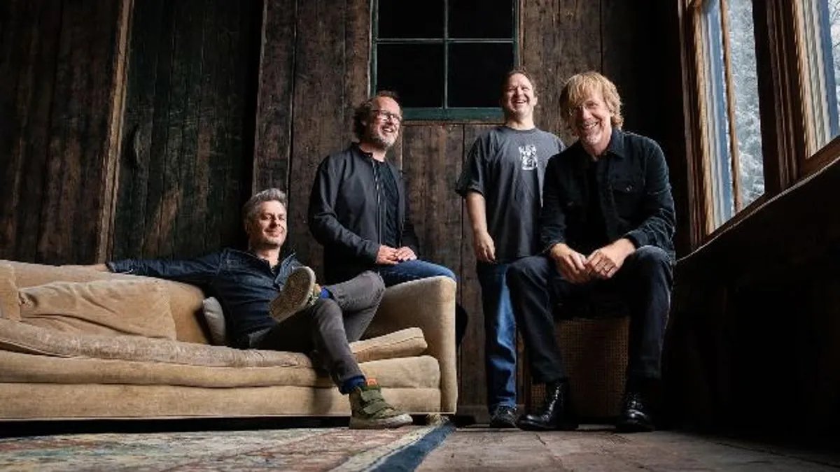 The Sphere in Las Vegas lit up with vibrant colors and geometric patterns, showcasing its massive scale and immersive capabilities during a Phish concert.