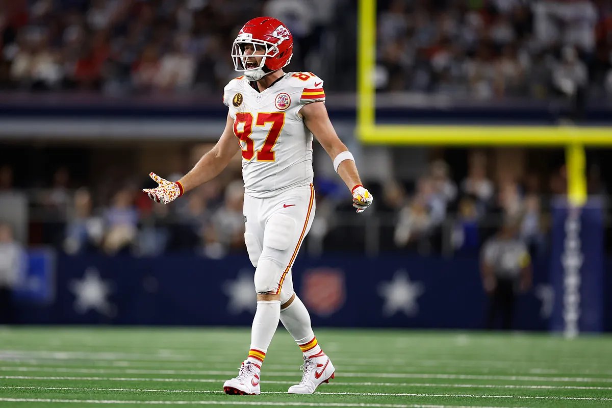 Travis Kelce celebrating a touchdown, showcasing his athletic prowess