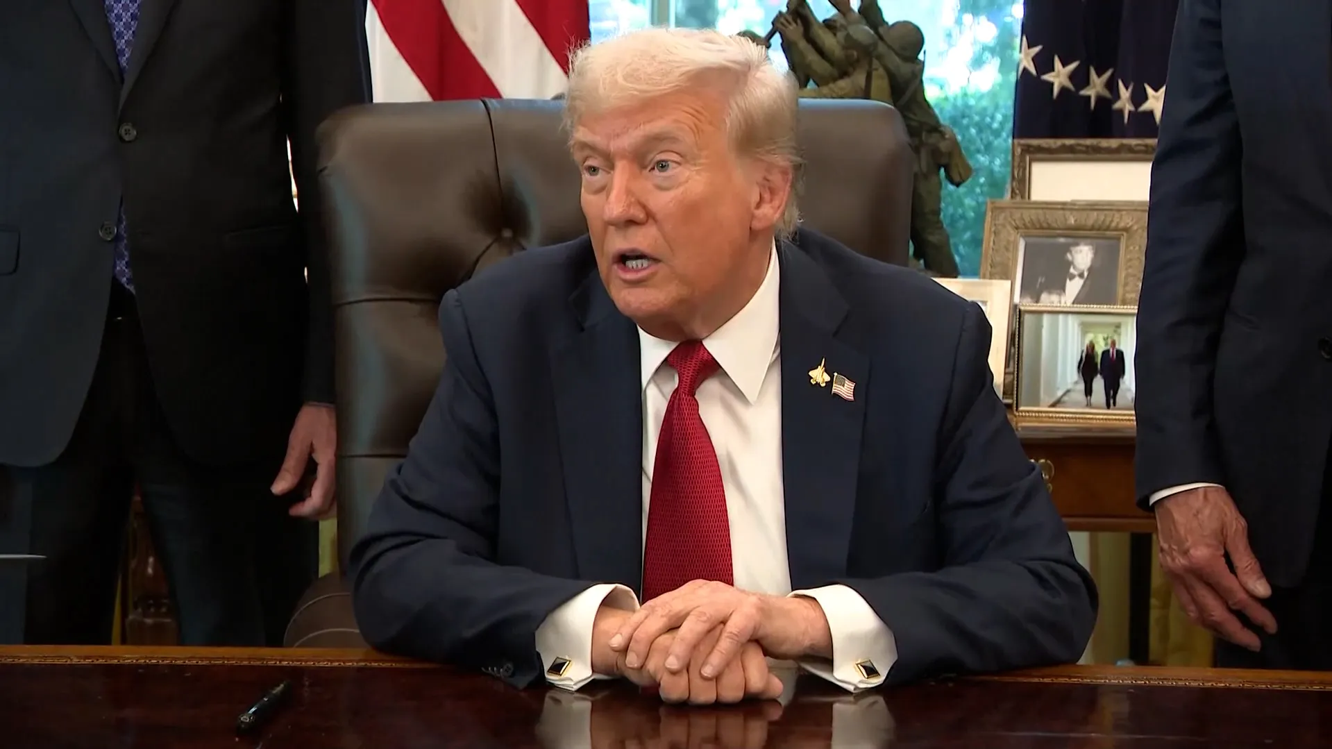 50 Cent smiling and posing for a photo.