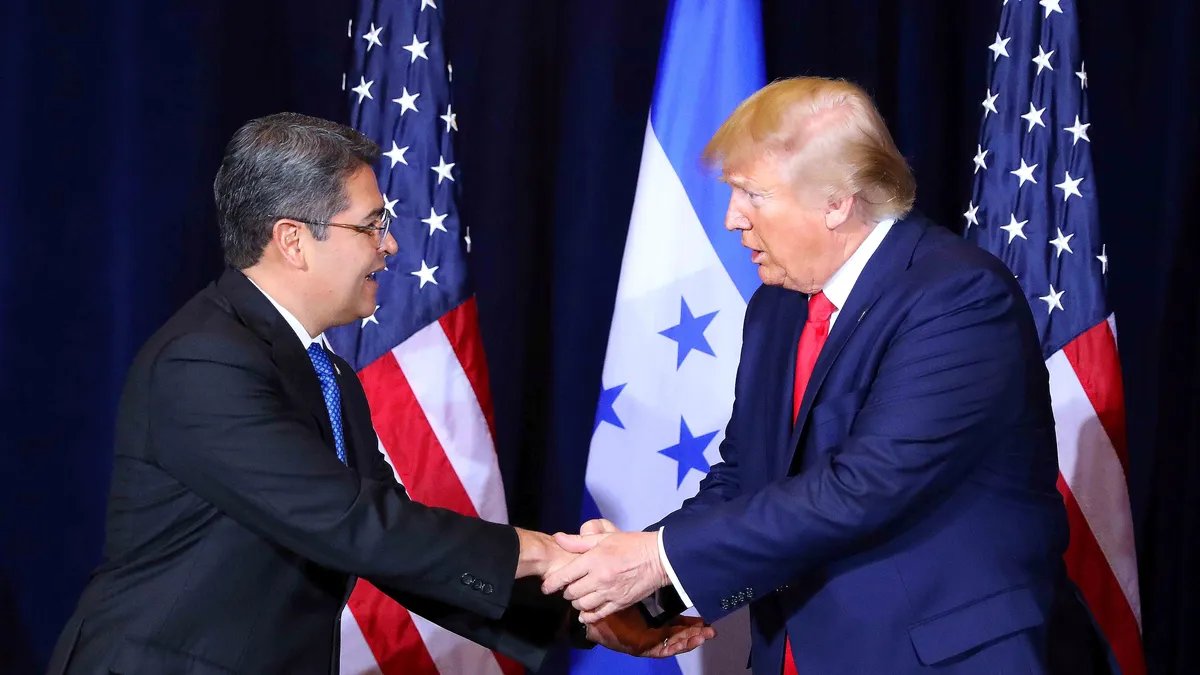 Donald Trump and Juan Orlando Hernandez pictured together, hinting at their relationship.