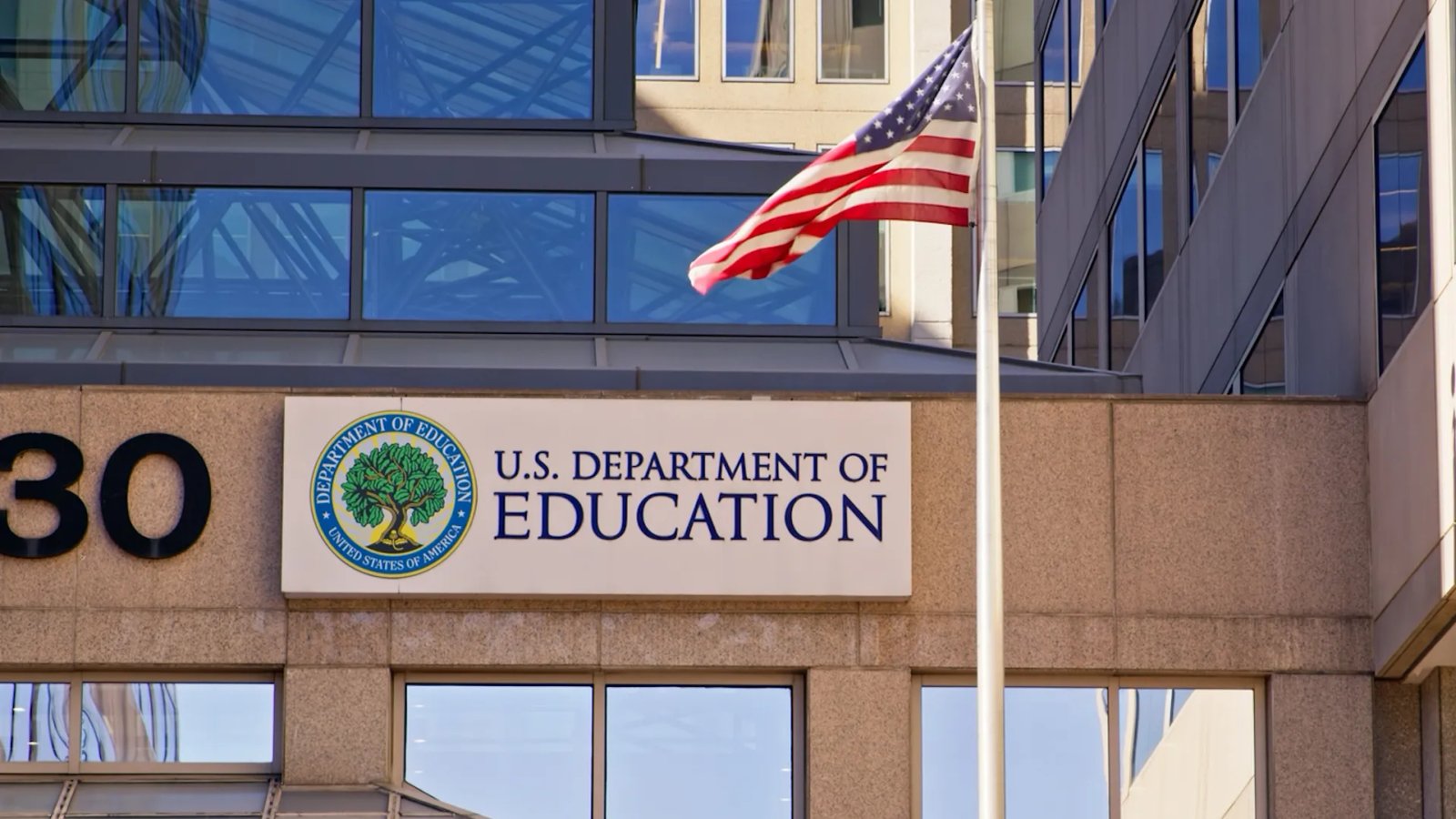 A beleaguered department official faces reporters, explaining the urgent need for experienced personnel.