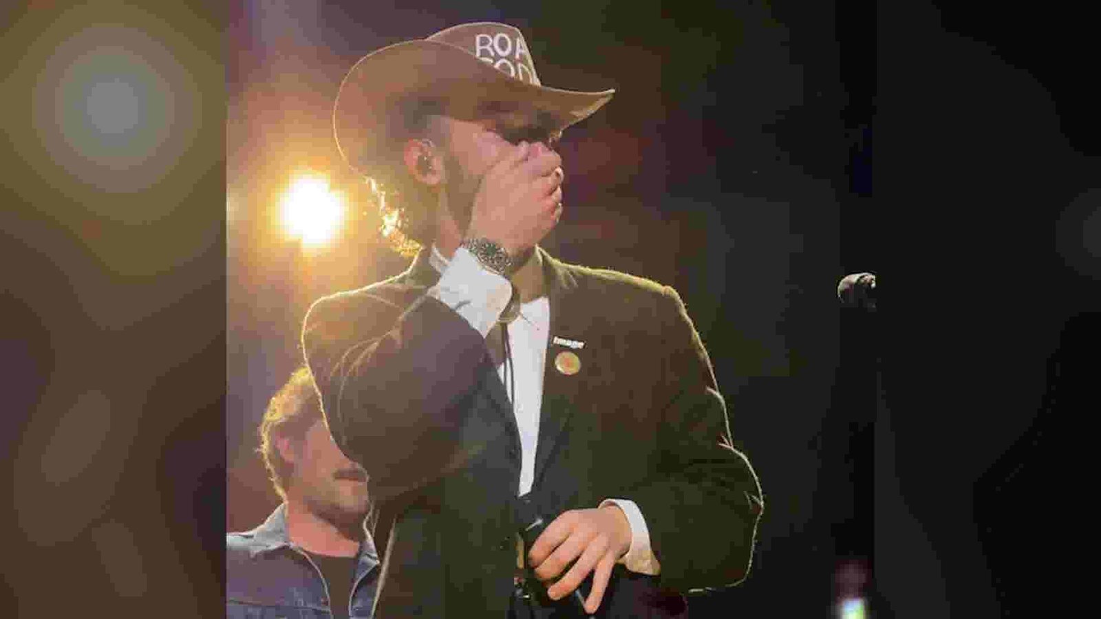 Frankie Jonas wiping away tears on stage, overwhelmed by fan support