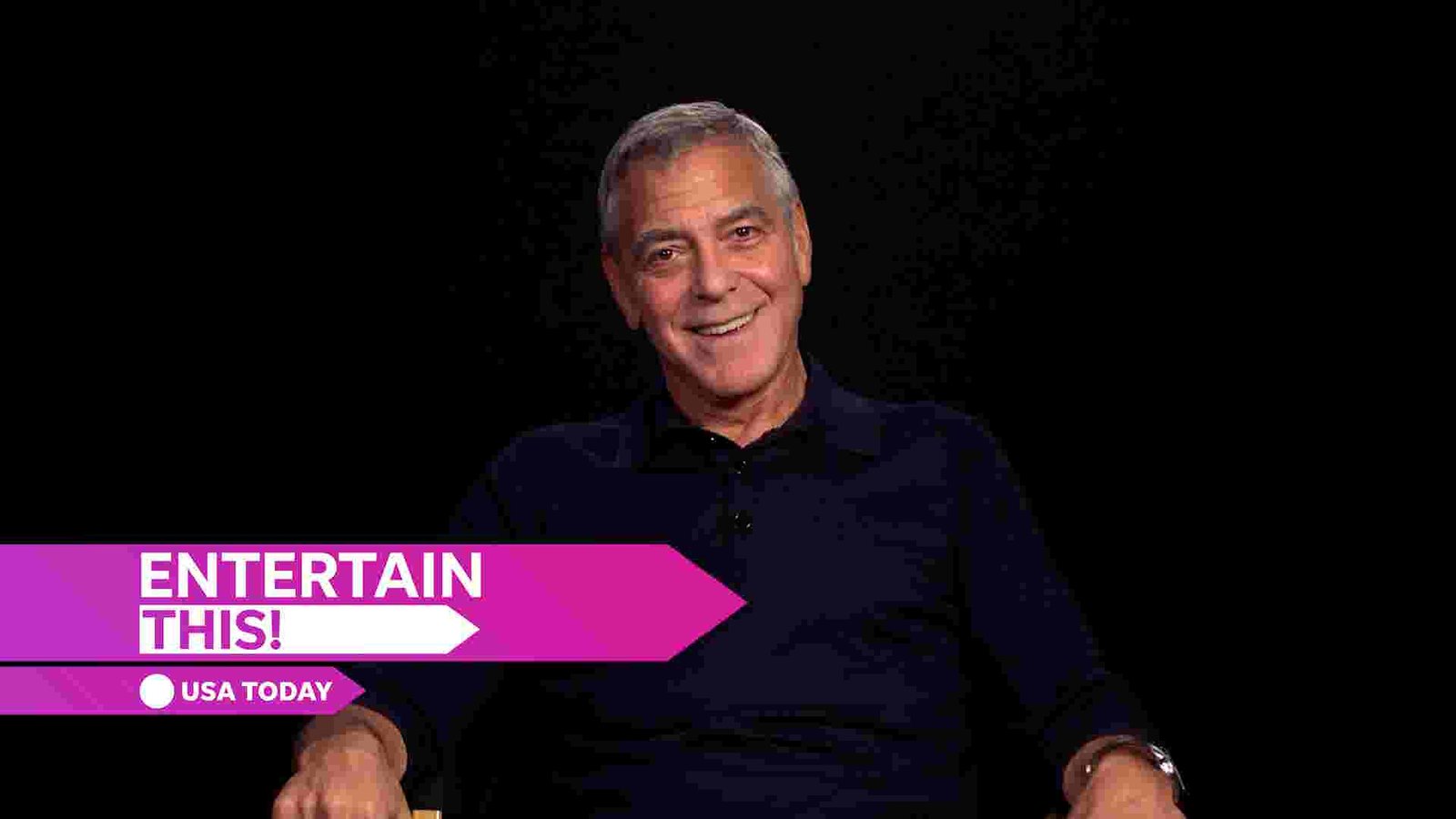 George Clooney smiling, reflecting on his career and father's influence.