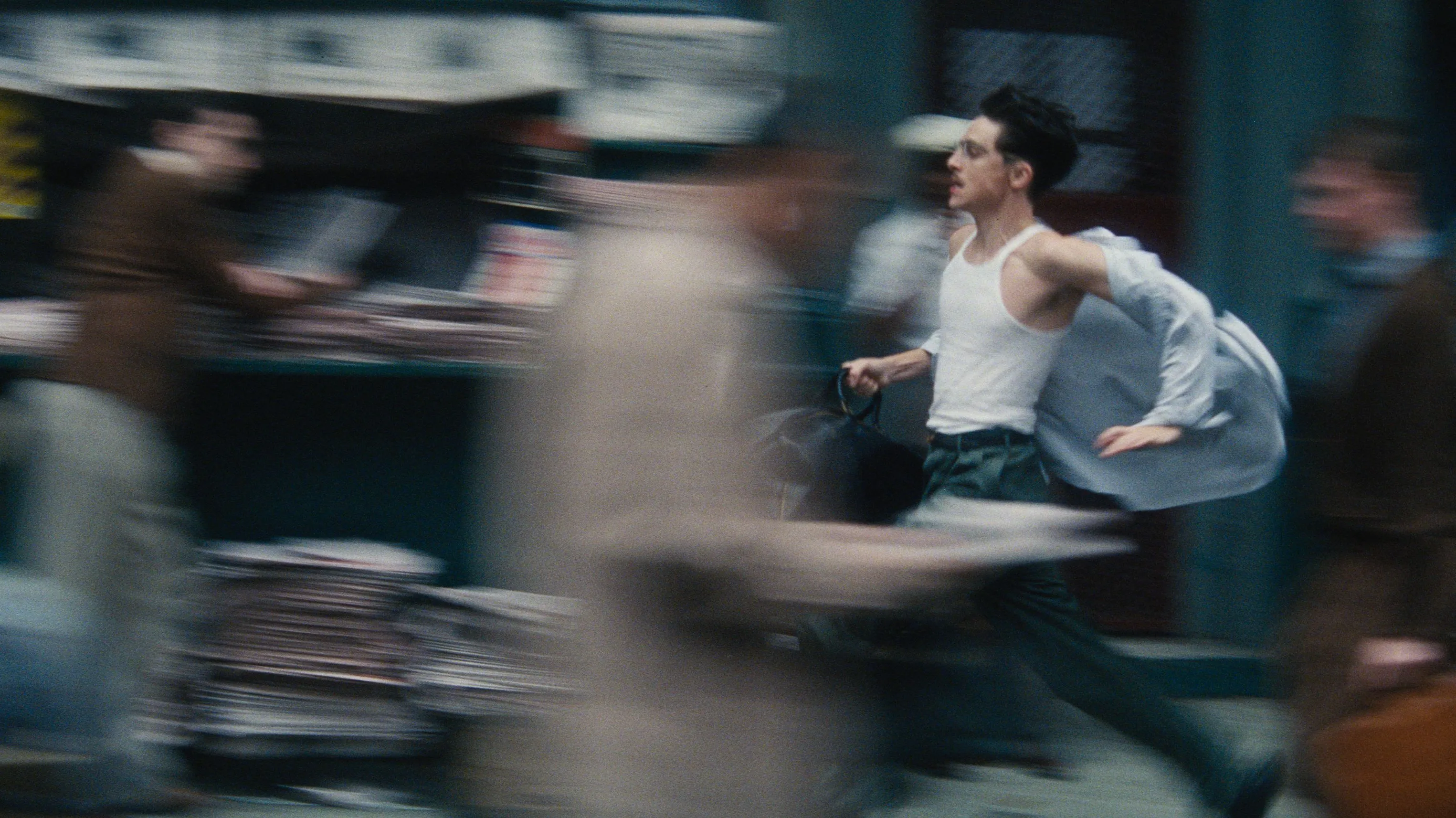 Gwyneth Paltrow and her son Moses Martin attending the 'Marty Supreme' premiere, both dressed elegantly.