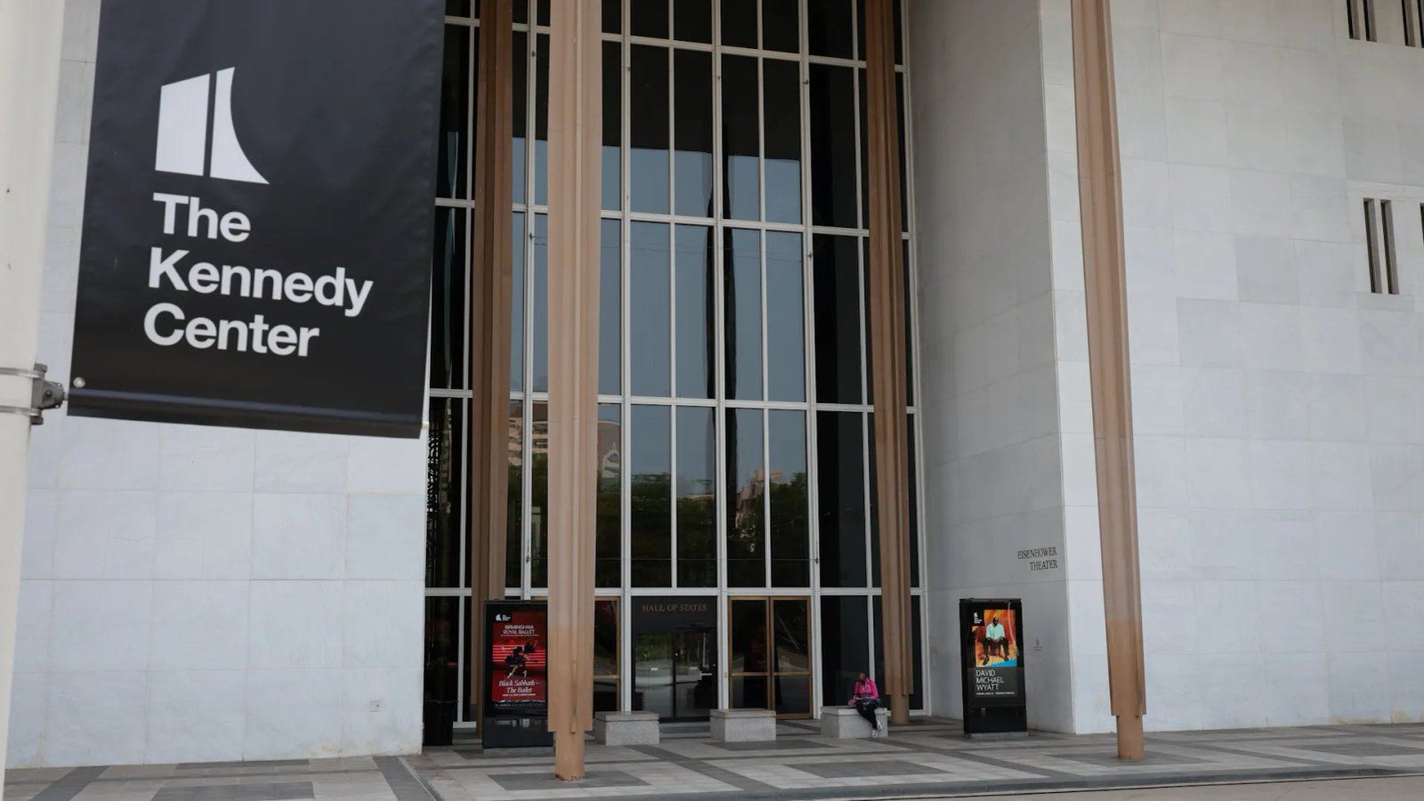A jazz trumpeter, possibly Marcus 'Mojo' Johnson, performing with a serious expression, reflecting the band's artistic integrity.