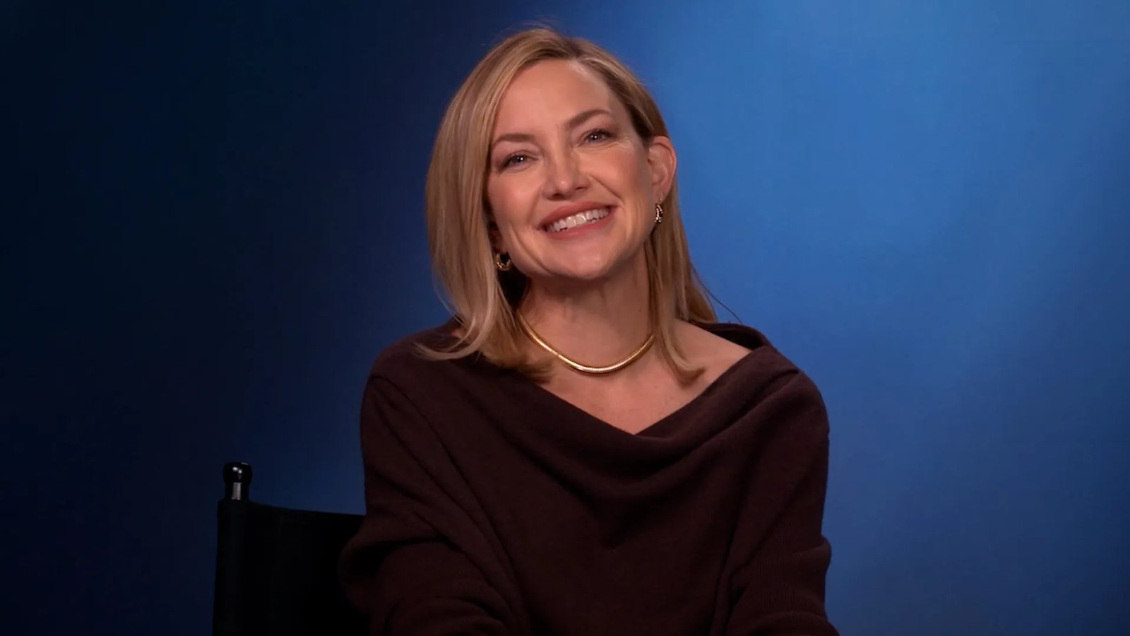 A close-up of Neil Diamond reacting with joy and emotion during Kate Hudson's surprise performance of 'Song Sung Blue'.