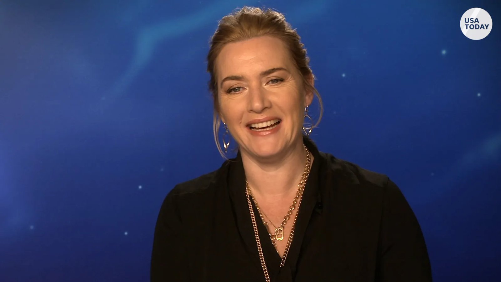 A close-up of Kate Winslet, highlighting her natural expressions