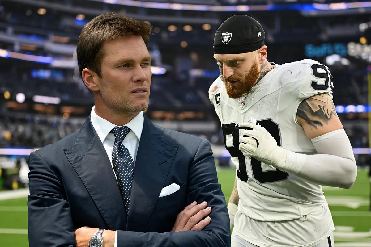 Tom Brady watching a Raiders game from the owner's box.