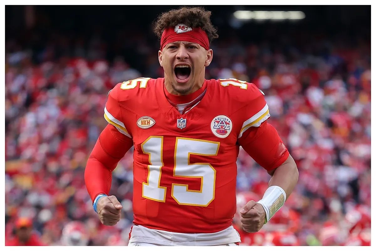 Patrick Mahomes reacts with visible concern as a teammate is attended to on the field.