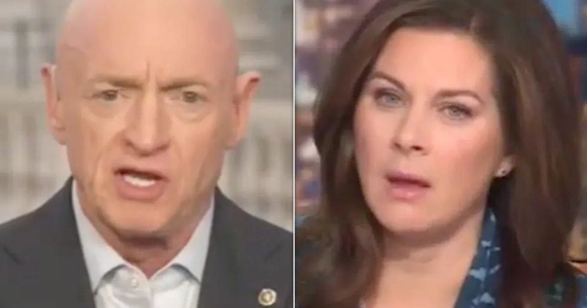 Sen. Mark Kelly speaking at a press conference.