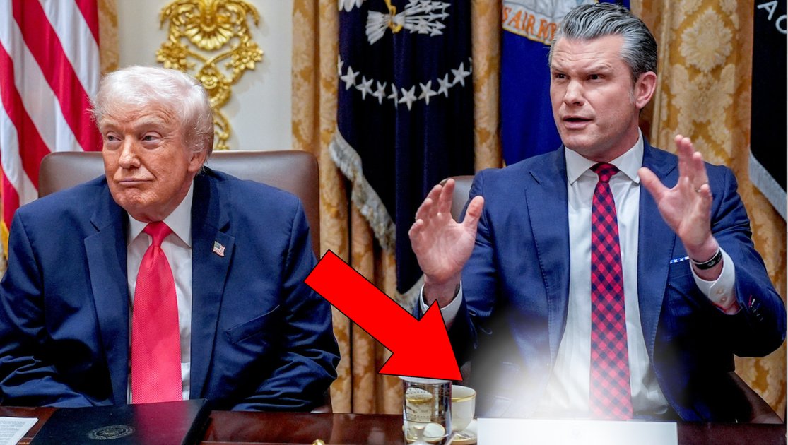 Pete Hegseth holding a placard with a misspelled word.