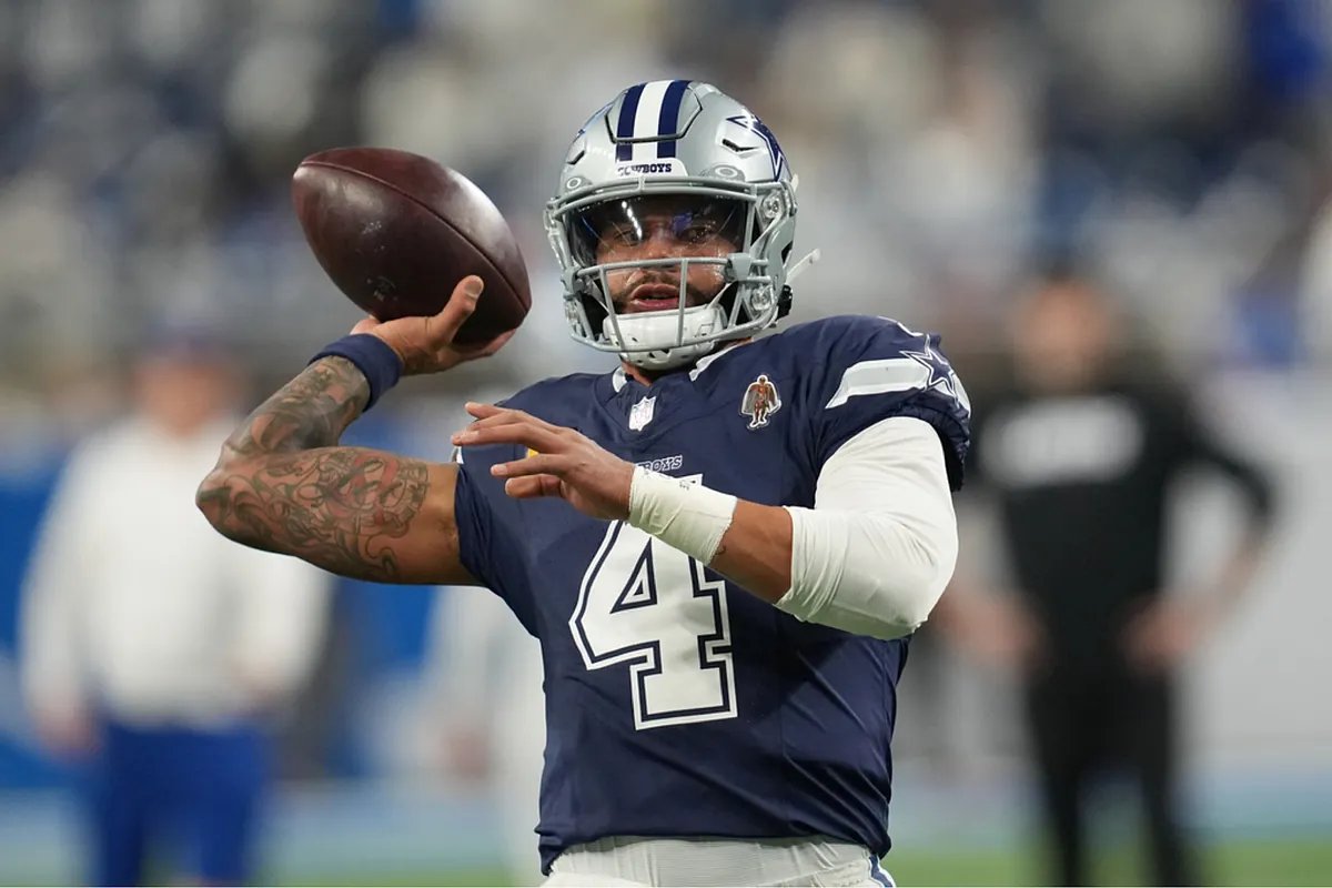 Dak Prescott under pressure, embodying the Cowboys' critical postseason situation