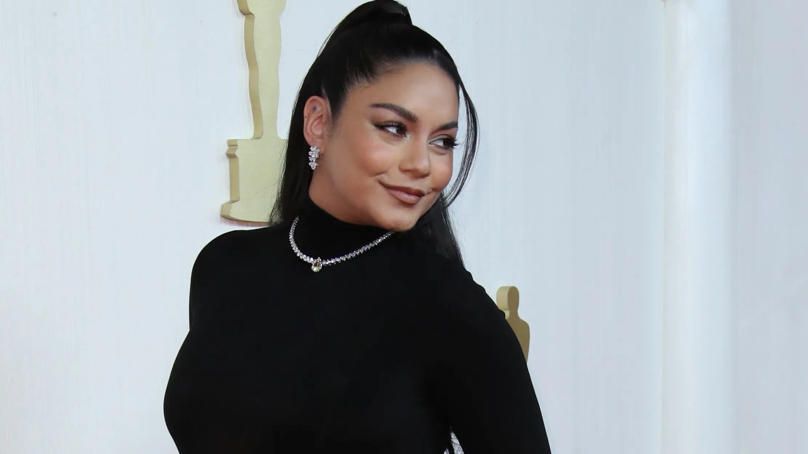 Vanessa Hudgens and Cole Tucker at an event.