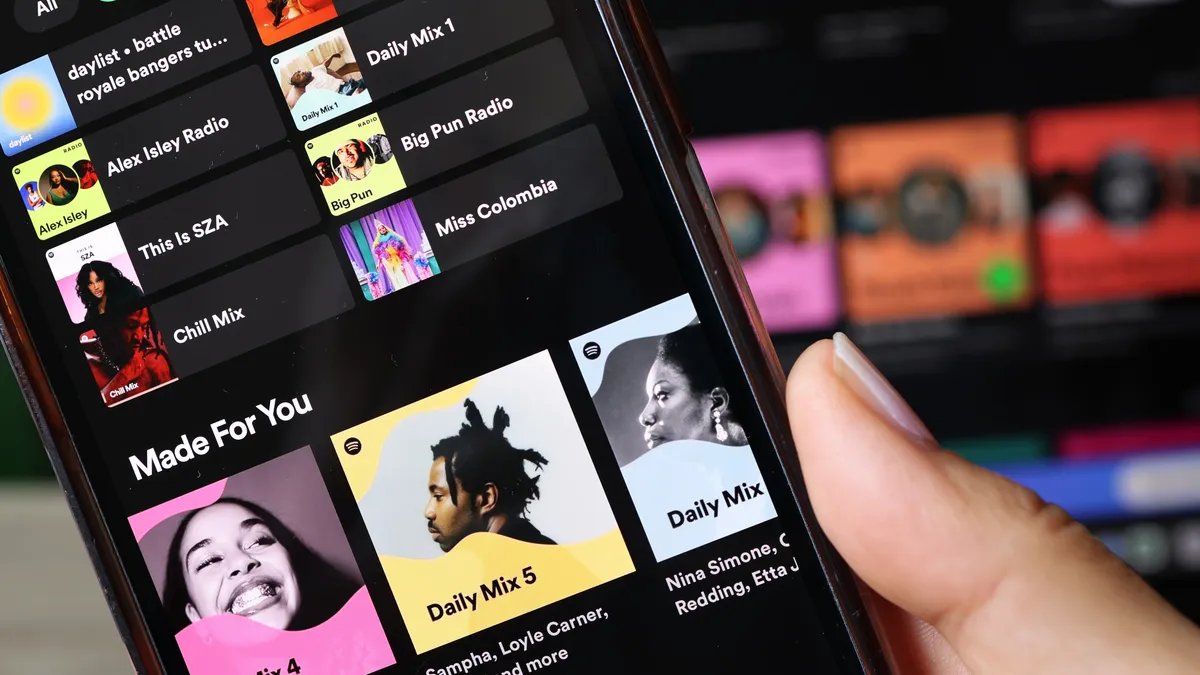 Spotify Wrapped 2024 displayed on a phone screen, showing personalized listening statistics.