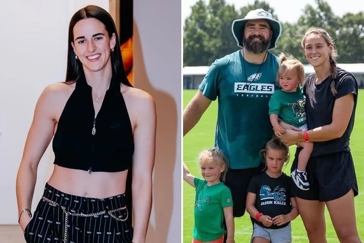 Caitlin Clark dribbles down court, eyes focused, surrounded by blurred opponents in a packed WNBA arena.