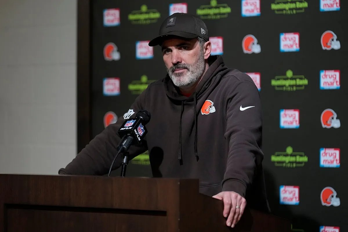Kevin Stefanski walks off the field with a somber expression