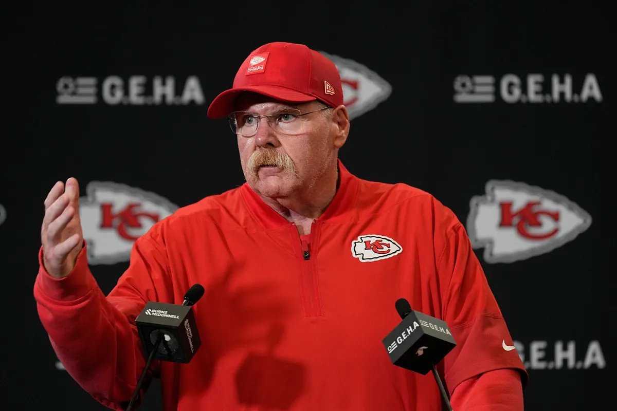 Andy Reid, head coach of the Kansas City Chiefs, looking intently at a practice field, symbolizing strategic planning.