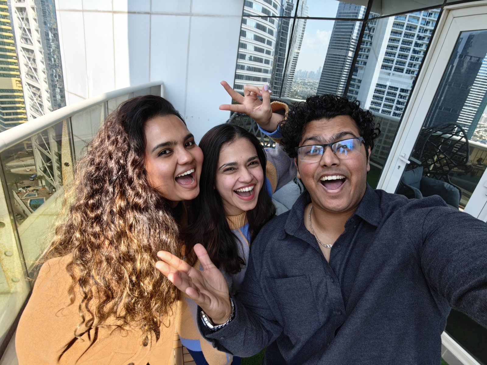 A user holding the OPPO Reno15, focusing on its sleek display and user interface.
