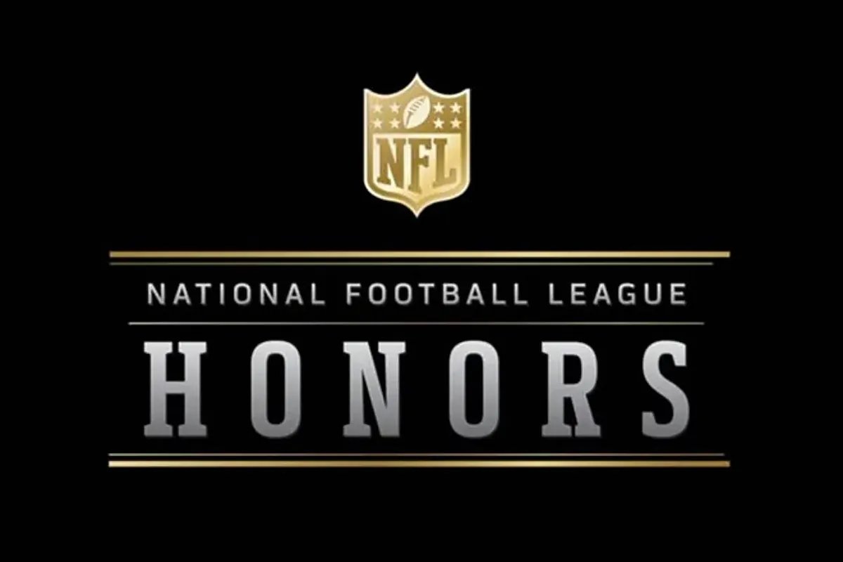 The NFL Honors 2026 stage, decorated with large screens showing player highlights and the NFL logo, as the audience awaits the announcement of winners.