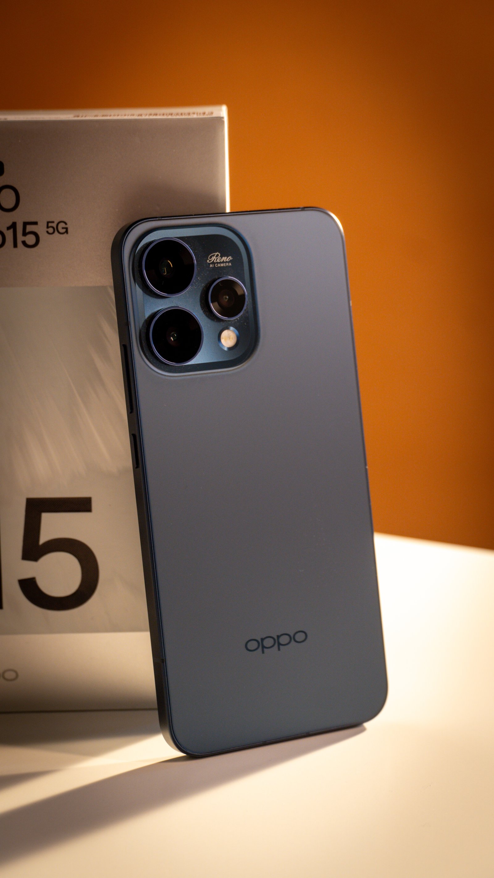 Close-up of the OPPO Reno15's advanced camera module with multiple lenses.