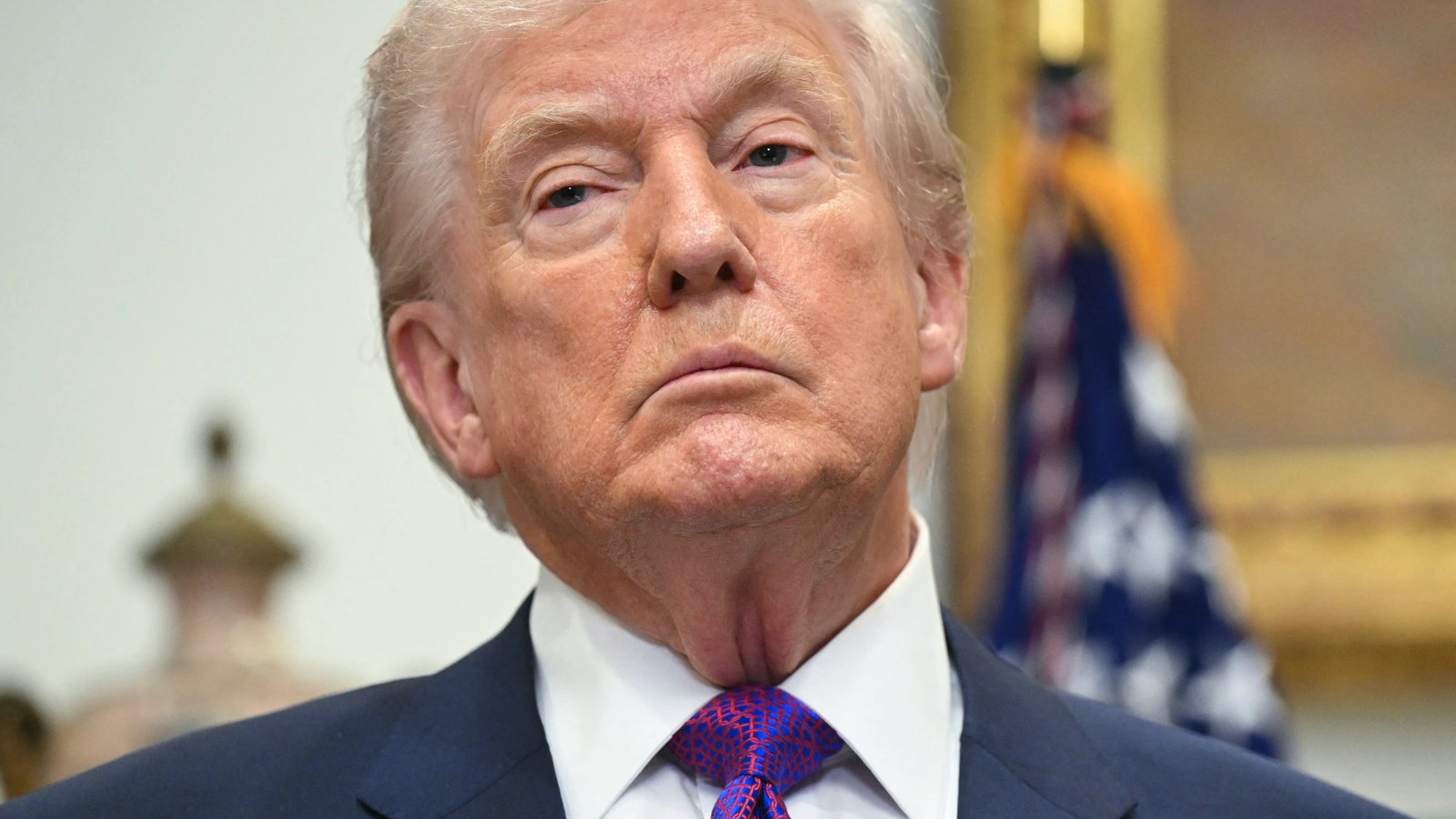 A 'Vote Here' sign at a school gymnasium serving as a polling place