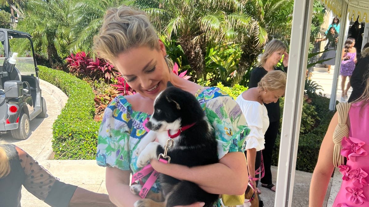Katherine Heigl holds rescued dog at Big Dog Ranch Rescue Mar-a-Lago fundraiser
