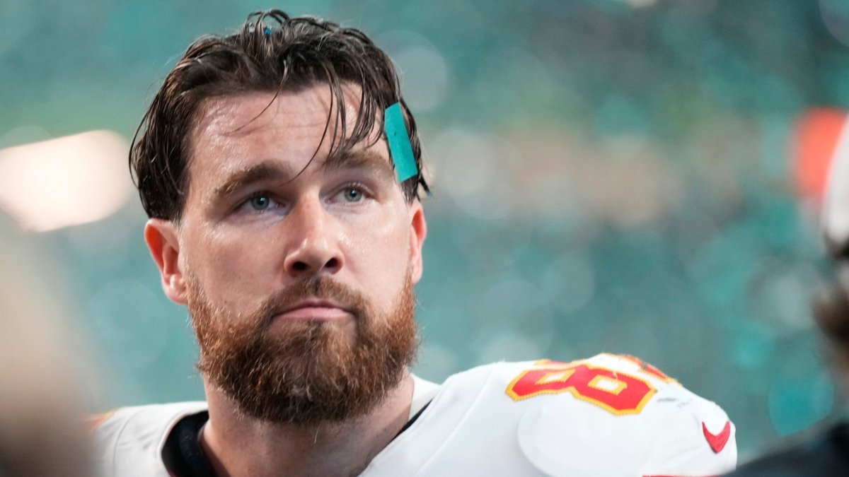 Travis Kelce catching a pass during a Chiefs game at Arrowhead Stadium Travis Kelce catching a pass during a Chiefs game at Arrowhead Stadium