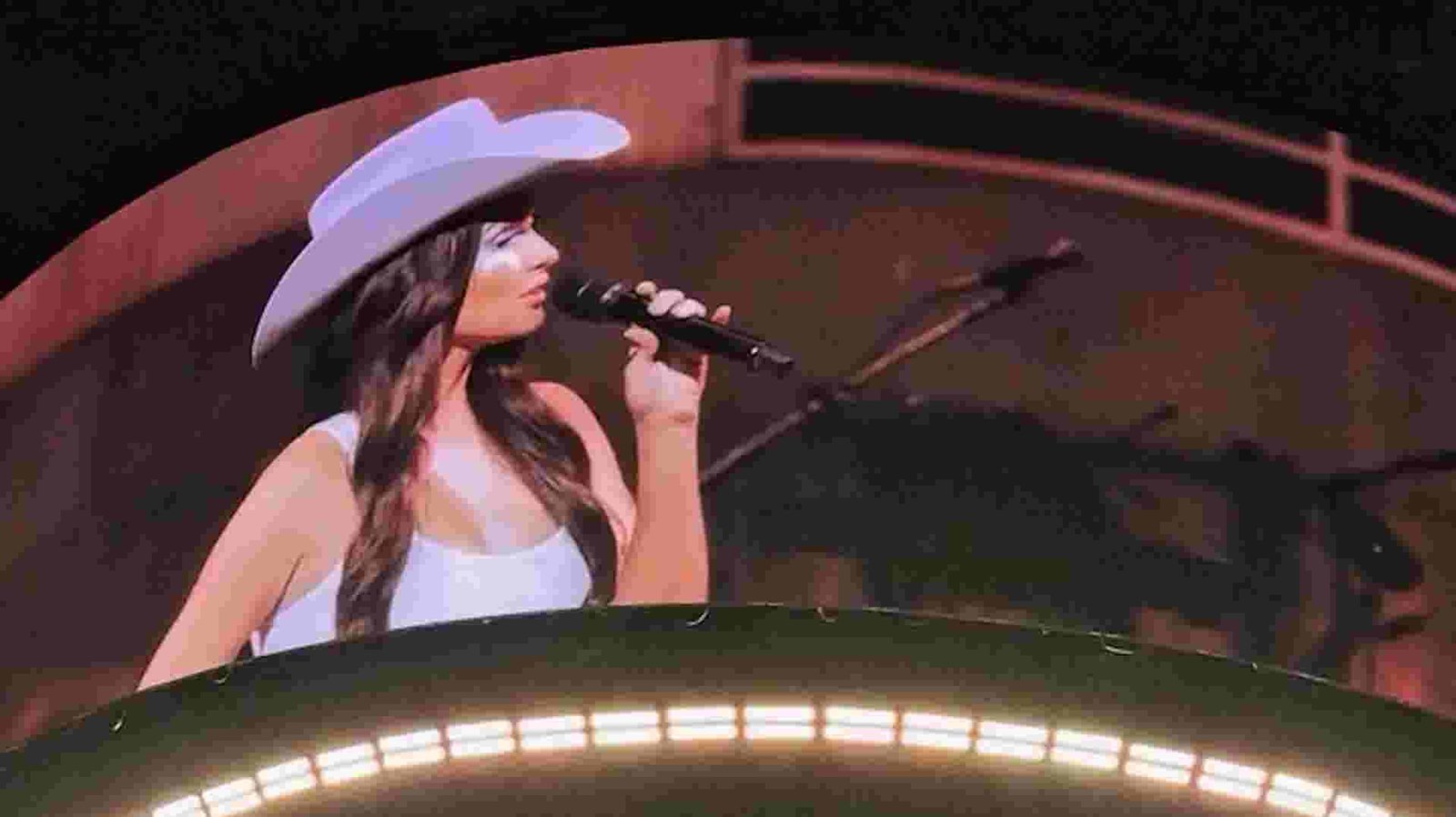 Kacey Musgraves speaking on stage at the United Center Kacey Musgraves speaking on stage at the United Center
