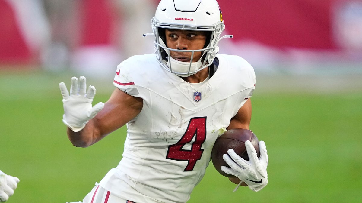 JJ Watt speaking with Rondale Moore on the sidelines during an Arizona Cardinals practice session for Hard Knocks JJ Watt speaking with Rondale Moore on the sidelines during an Arizona Cardinals practice session for Hard Knocks