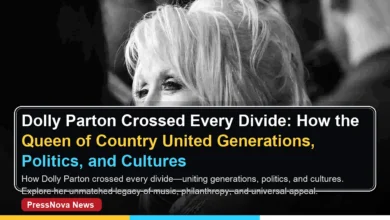 Dolly Parton smiling in iconic blonde wig and colorful outfit on stage