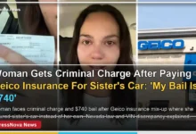 Woman holding Geico insurance citation after criminal charge for VIN mix-up