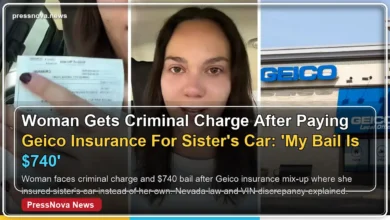 Woman holding Geico insurance citation after criminal charge for VIN mix-up