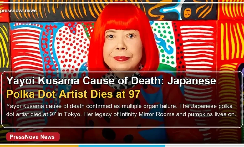 Yayoi Kusama wearing her signature red wig and polka dot outfit in her Tokyo studio